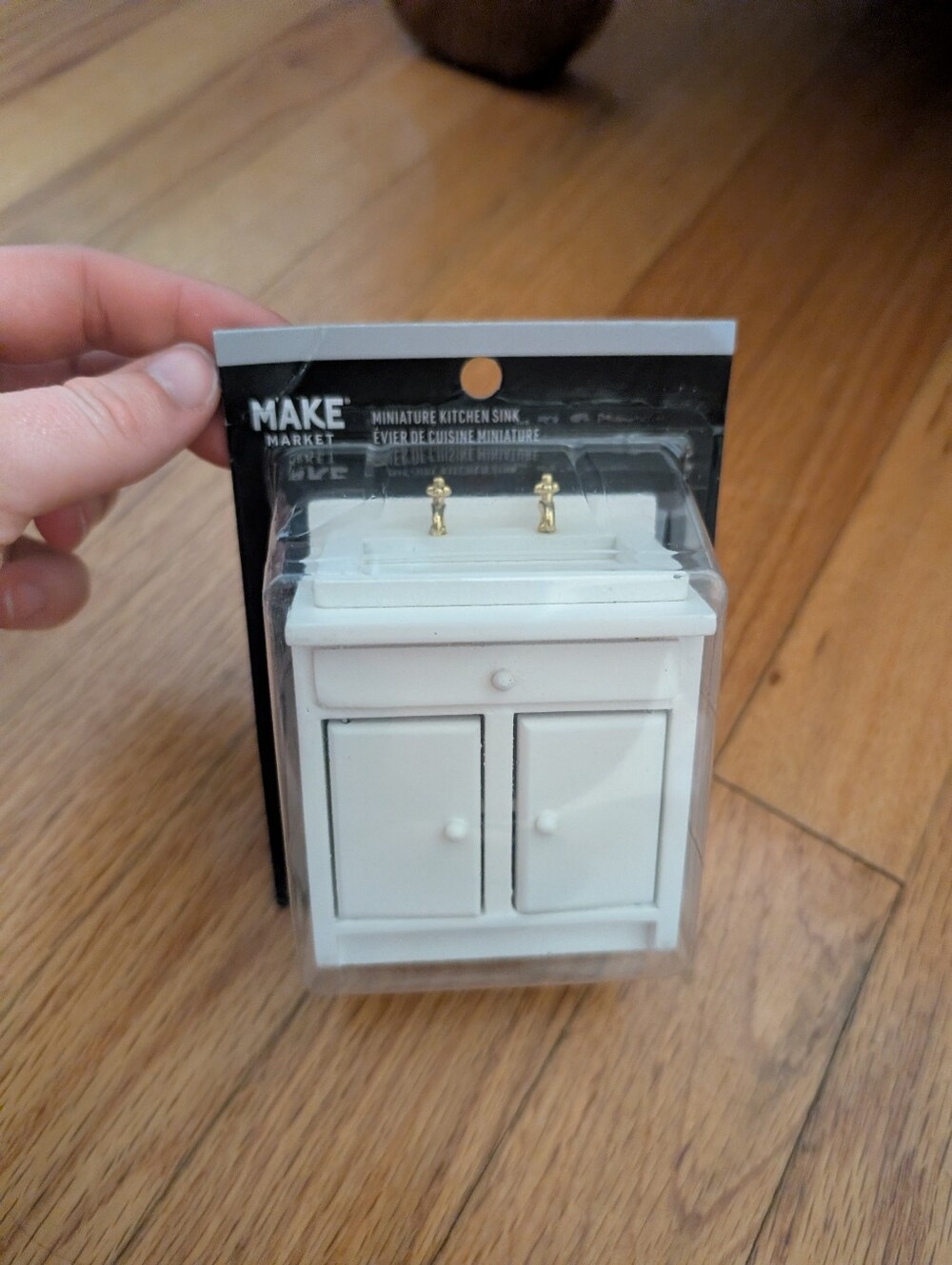 Miniature White Vanity Sink with Gold Faucets